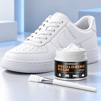 White shoe restorer cream with applicator brush and white sneaker