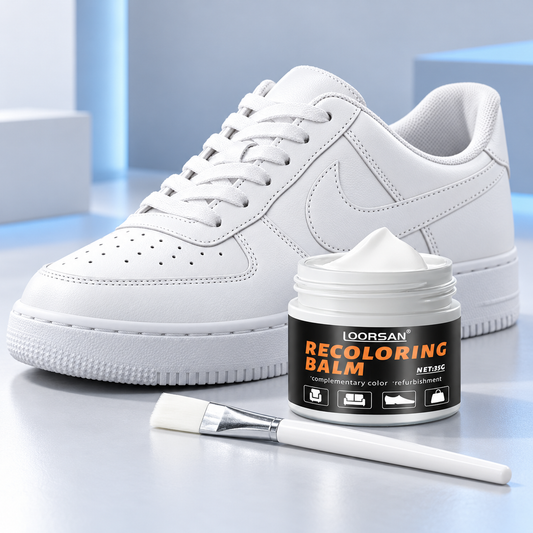 White shoe restorer cream with applicator brush and white sneaker
